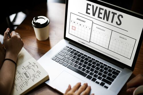 Photo of laptop opened to event planning calendar for creating better live events through technology